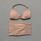 Pink women's bikini set with halter top and high-waisted bottoms, soft fabric, minimalist design