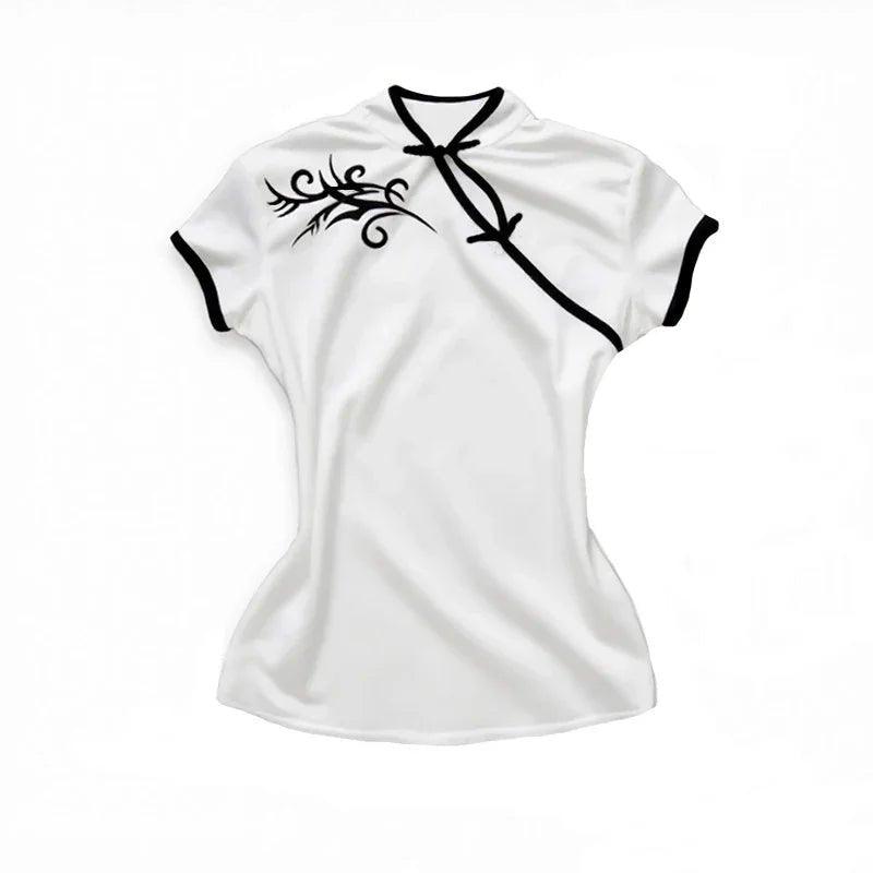 White women's fashion top with black trim and tribal print, stylish short sleeve blouse