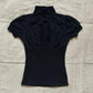Black women's blouse with ruffled high neck and puff sleeves, elegant fashion top