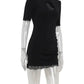 Black lace-trim mini dress with short sleeves and ruched detail on mannequin