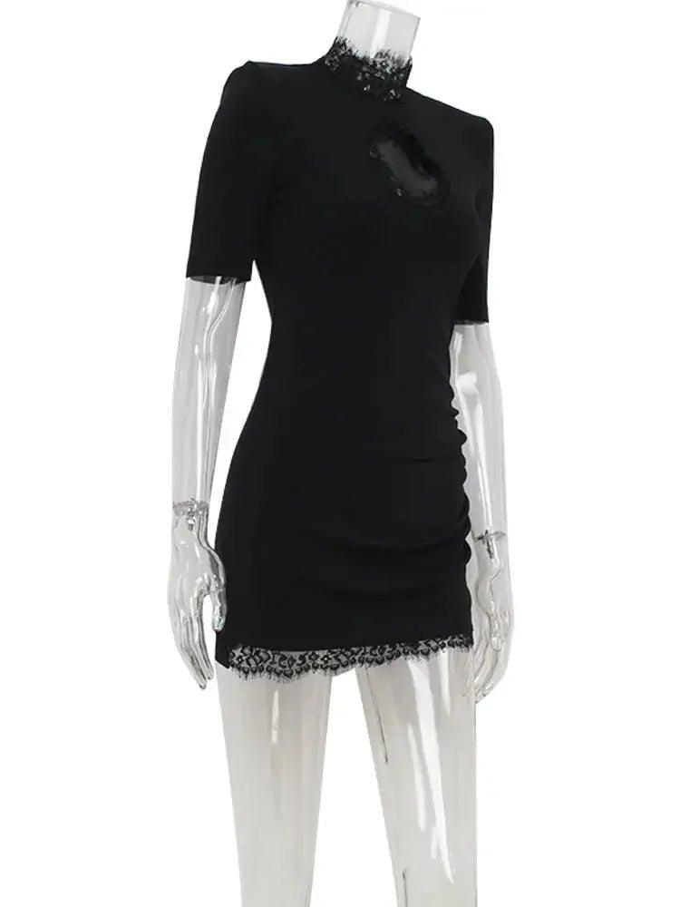 Black lace-trim mini dress with short sleeves and ruched detail on mannequin