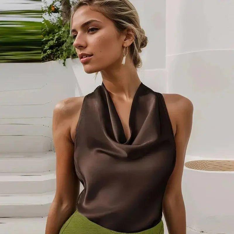 Woman in elegant brown satin halter top, chic summer fashion