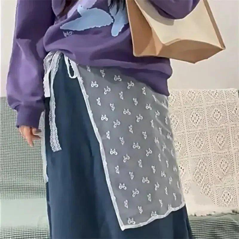 Purple hoodie with butterfly print paired with lace-trimmed gray overlay skirt, women’s fashion outfit