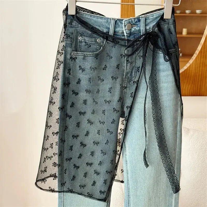 Women's denim jeans with sheer lace overlay and bow print, stylish fashion pants