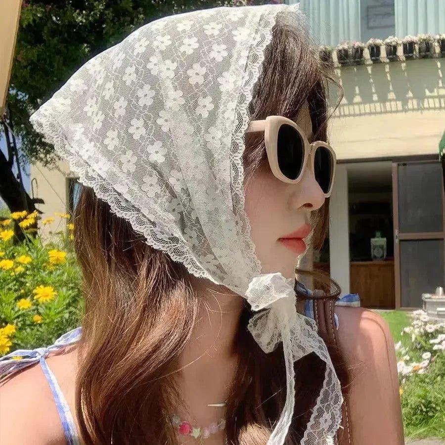 Woman wearing floral lace headscarf and sunglasses, summer fashion accessory