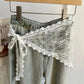 White lace waist tie for women's jeans, floral pattern, tied bow detail, fashion accessory