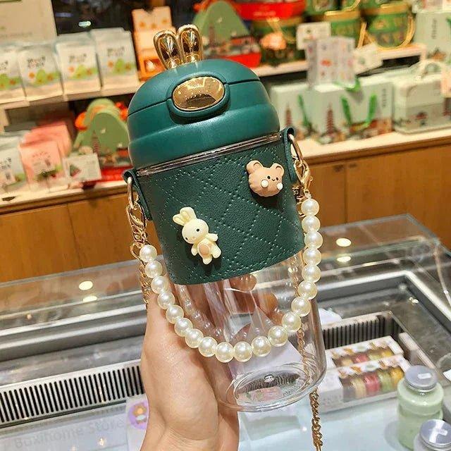 Cute green water bottle with pearl strap, bunny & bear charms, perfect for women's fashion
