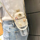 Cute pearl-embellished crossbody water bottle bag with bunny ears, perfect for women's fashion