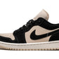 Black and beige low-top sneaker with suede texture and iconic swoosh design
