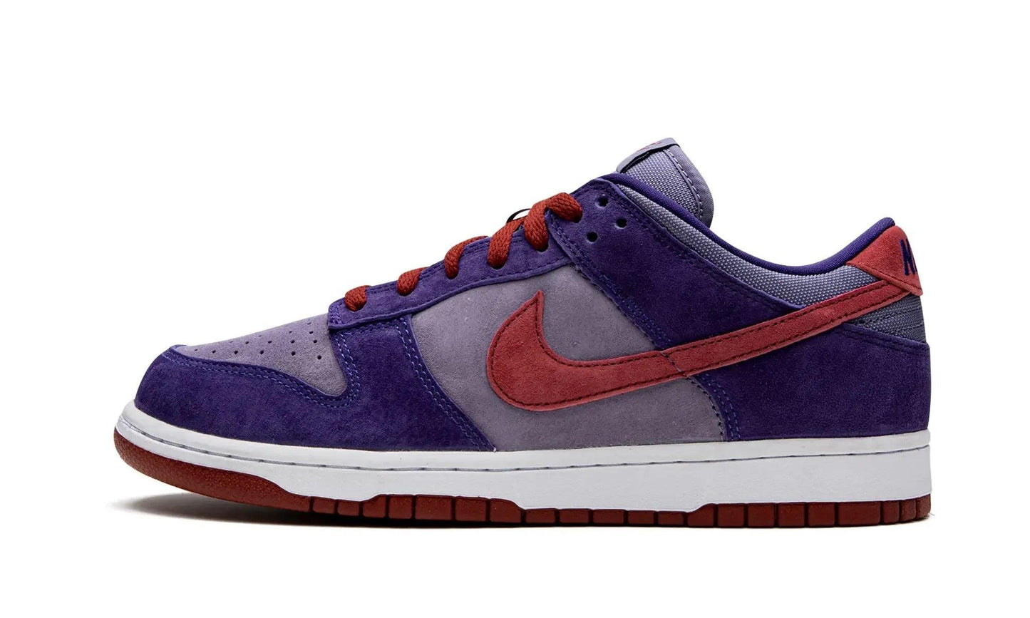Purple and red Nike Dunk Low sneaker with suede texture and white sole, women's fashion footwear