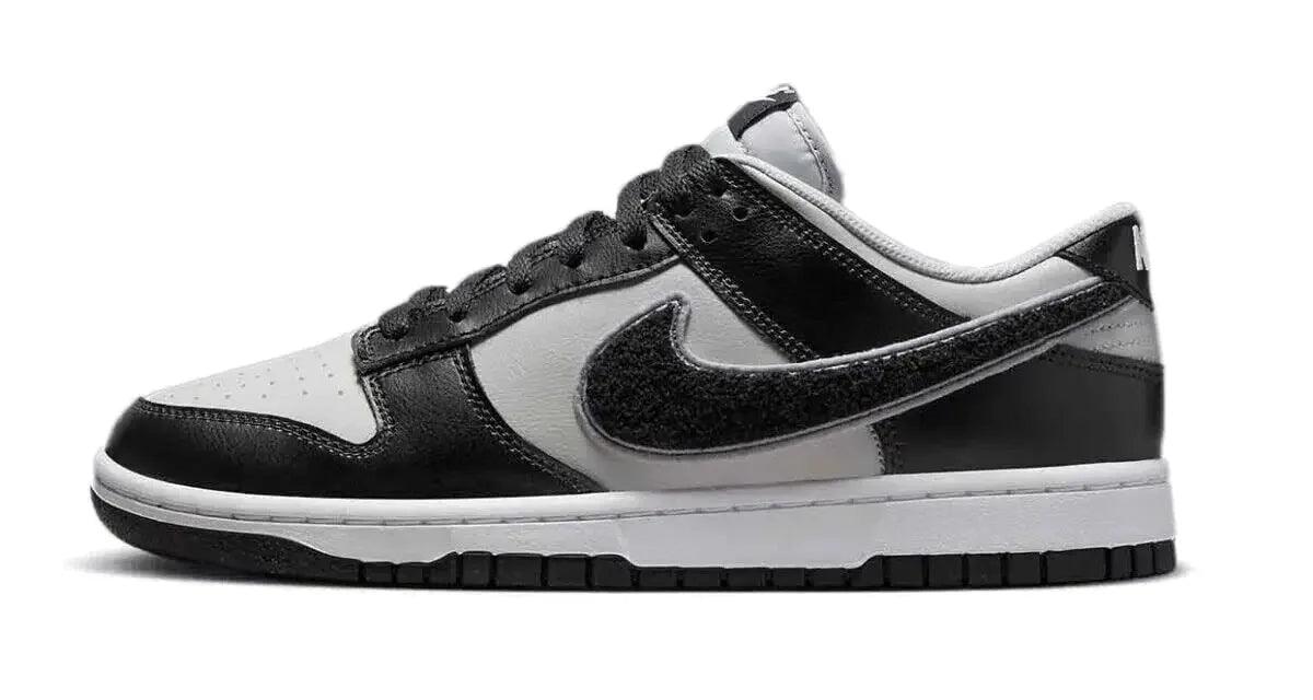 Black and white Nike Dunk Low sneaker with classic design and textured swoosh, ideal for casual fashion