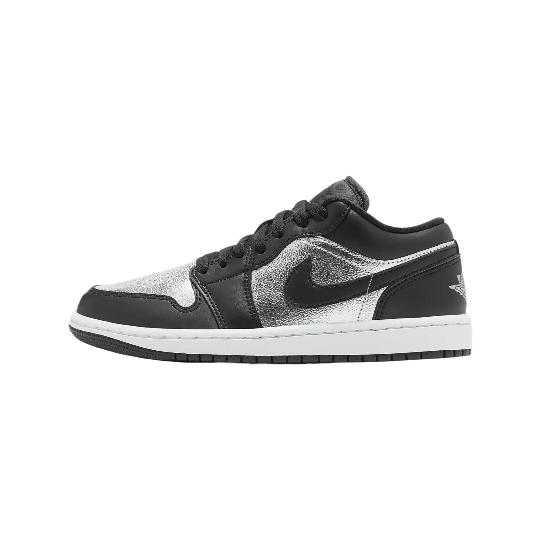 Black and silver women's low-top sneaker with white sole and metallic accents