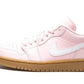 Pink women's low-top sneaker with white swoosh and gum sole, stylish fashion footwear