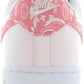 White Nike Air sneaker with pink bandana print heel tab, women's fashion footwear