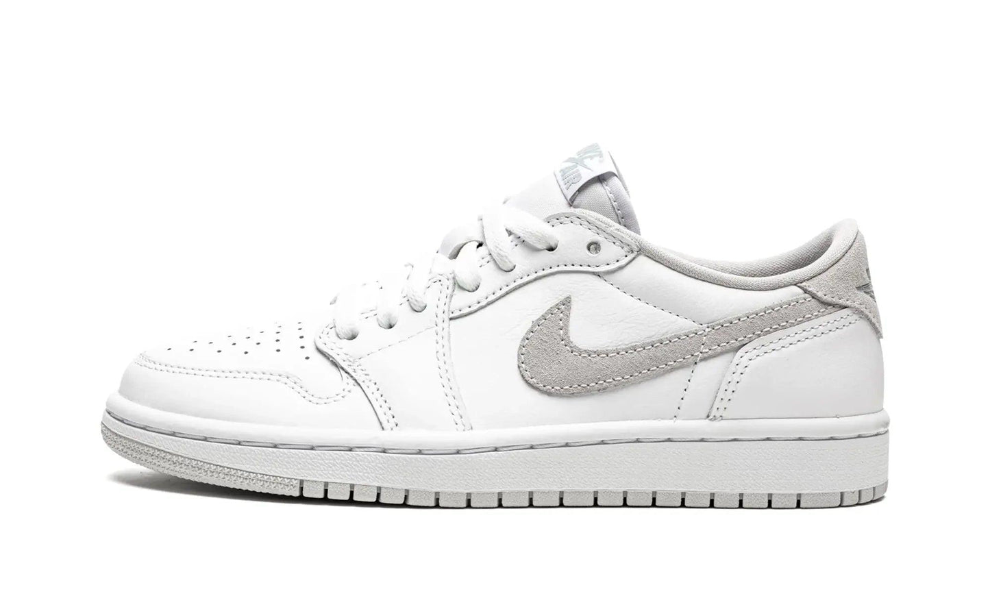 White women's low-top sneaker with gray accents and Nike swoosh, ideal for casual fashion