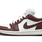 White and burgundy Air Jordan 1 Low sneaker with Nike swoosh, ideal for women's fashion and casual wear