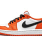 Orange and white low-top sneaker with black swoosh, ideal for women's fashion and streetwear style