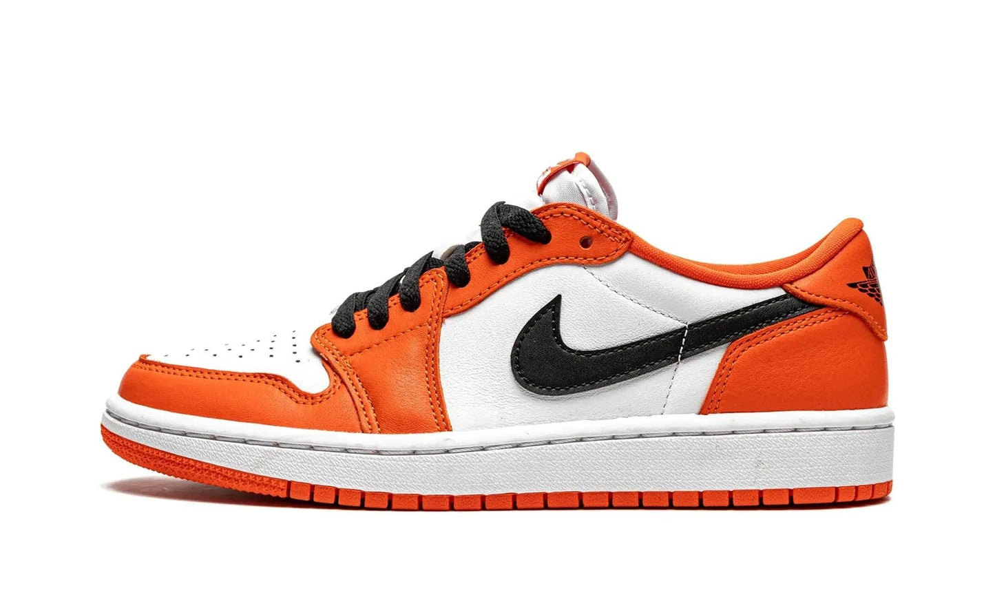 Orange and white low-top sneaker with black swoosh, ideal for women's fashion and streetwear style
