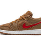 Brown shearling low-top sneaker with red swoosh, white sole, cozy winter fashion footwear