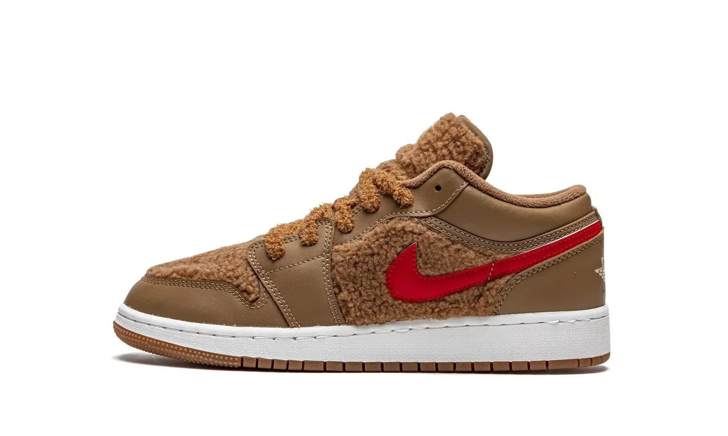 Brown shearling low-top sneaker with red swoosh, white sole, cozy winter fashion footwear