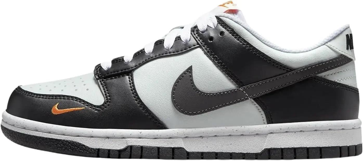 Nike Dunk Low sneaker in black, white, and orange, featuring classic design and sporty style for women's fashion.
