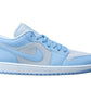 Light blue and white low-top sneaker with Nike swoosh, ideal for women's fashion and casual wear