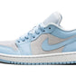 Light blue and grey women's low-top sneaker with white sole and Nike swoosh
