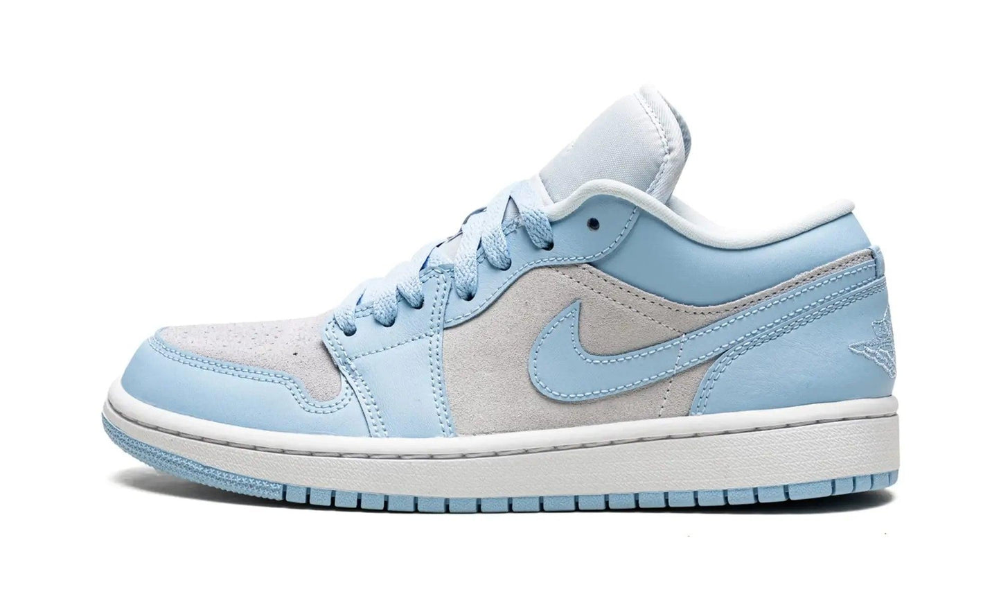 Light blue and grey women's low-top sneaker with white sole and Nike swoosh