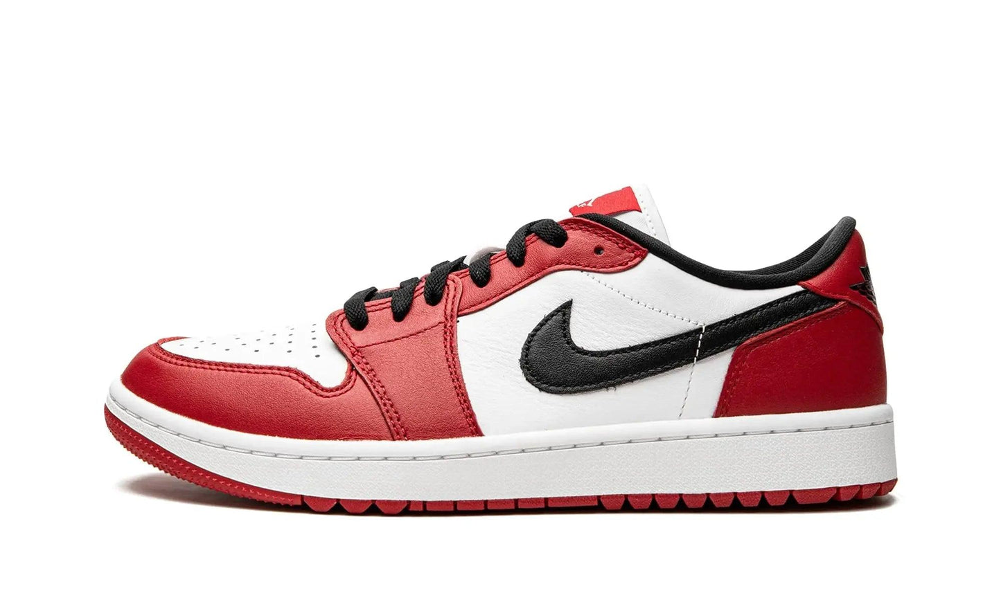 Red and white Nike Air Jordan 1 low sneaker with black swoosh, perfect for women's fashion and streetwear styles.