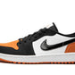 Women's black, white, and orange Nike Air Jordan 1 low sneaker with leather and suede details