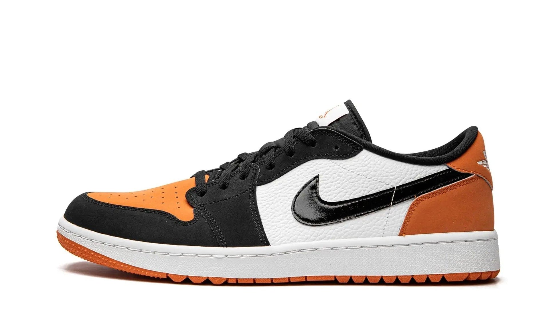 Women's black, white, and orange Nike Air Jordan 1 low sneaker with leather and suede details