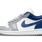 Women's white and blue low-top sneaker with gray accents and Nike swoosh, fashion footwear