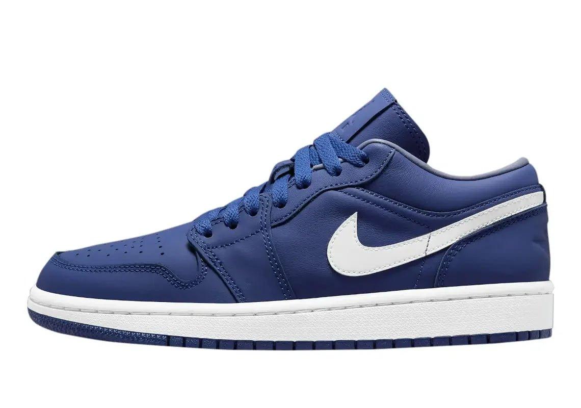 Navy blue low-top sneaker with white swoosh and sole, women's fashion footwear