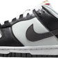 Black and white Nike Dunk Low sneaker with orange swoosh, women's fashion footwear