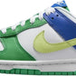 Nike Dunk Low sneaker in green, blue, and lime with white laces and Swoosh, women's fashion footwear