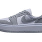 Gray suede women's platform sneaker with white sole and Nike swoosh