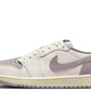 Women's white and lavender Nike Air Jordan 1 low sneaker with suede accents and classic design