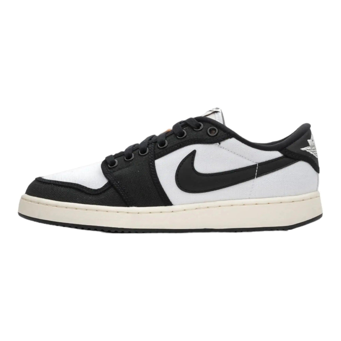 Black and white Nike Air Jordan 1 low-top sneaker with classic swoosh logo and cream sole