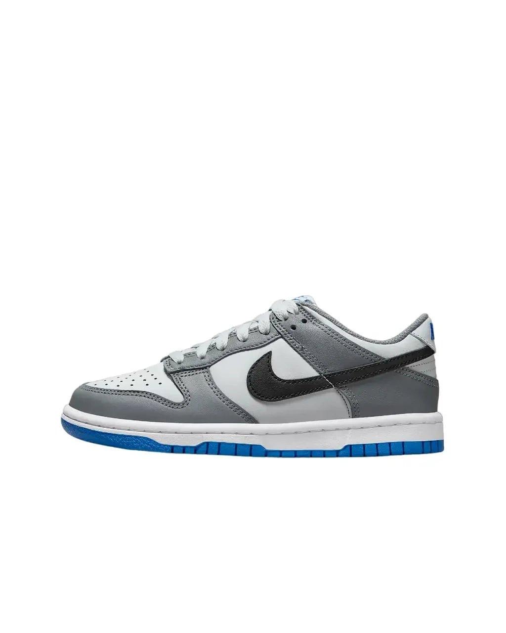 Gray and white Nike Dunk sneaker with blue sole, stylish women's fashion footwear