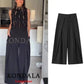 Black wide-leg pleated pants for women, paired with sequin top, stylish fashion outfit
