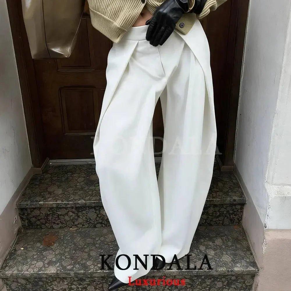 White wide-leg pants with pleats, styled with beige sweater and black gloves for women's fashion