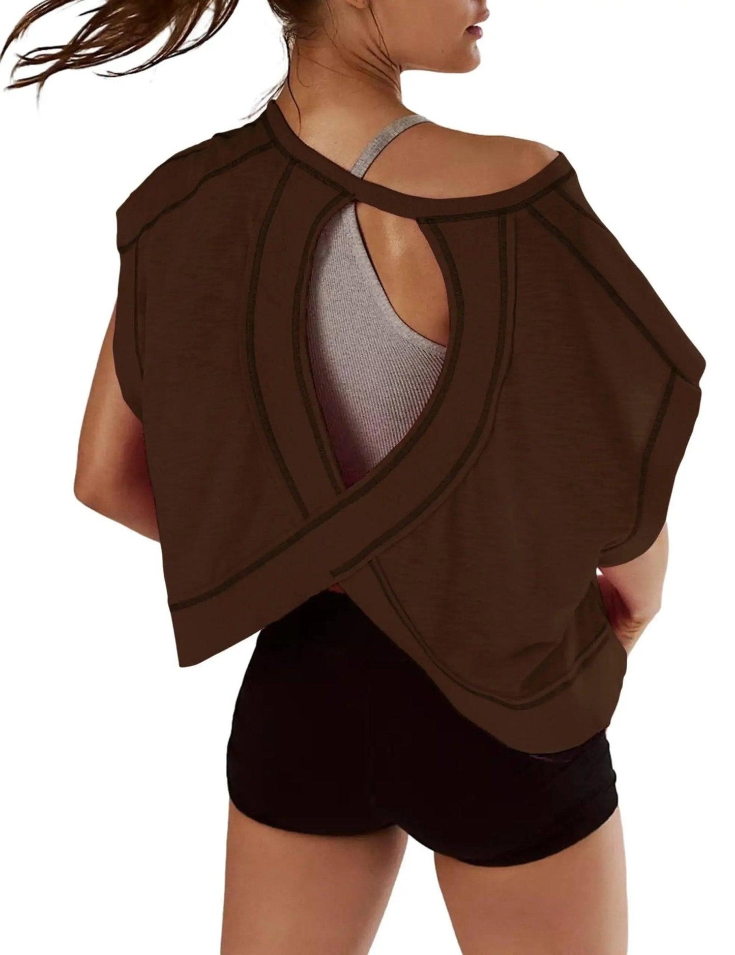 Brown open-back workout top with crisscross design, paired with black shorts for gym or yoga