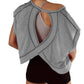 Gray women's open-back workout top with crisscross straps and black shorts, ideal for gym or yoga fashion