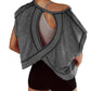 Gray open-back workout top with crisscross straps, paired with black shorts for women's fitness fashion