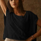 Woman in black oversized t-shirt and white cap, casual fashion style