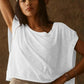Woman in white oversized t-shirt and cap, casual fashion style