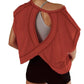 Rust red women's workout top with open back design, paired with black shorts for gym or yoga