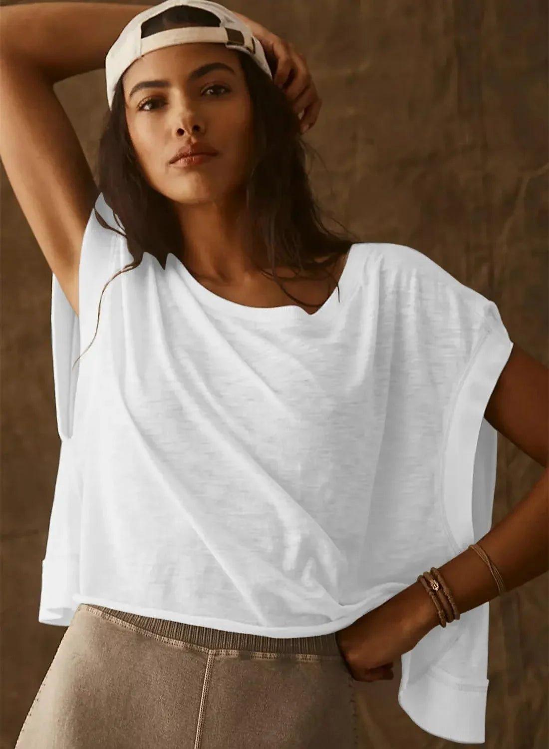 Woman in white oversized t-shirt and cap, casual fashion style