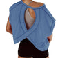 Blue women's workout top with open back design, paired with black shorts for gym or yoga