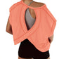 Coral open-back women's workout top with gray sports bra and black shorts, fitness fashion